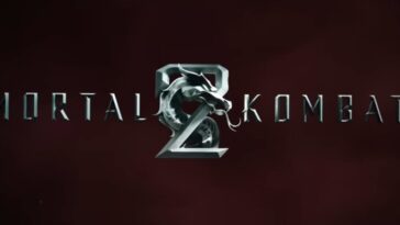 Logotipo oficial do filme Mortal Kombat 2 de 2026, com o título em letras prateadas texturizadas e o icônico dragão metálico no centro. O fundo é uma superfície texturizada vermelha escura e profunda.
